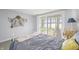 Bedroom with waterfront view and nautical decor, and lots of natural light at 7780 Paw Paw Dr, Nineveh, IN 46164
