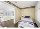 Bedroom features hardwood floors, neutral walls, white cabinets, and view to the living room at 7780 Paw Paw Dr, Nineveh, IN 46164