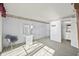 Bedroom with a lake view, desk, and carpeted floors. An attached bathroom is visible at 7780 Paw Paw Dr, Nineveh, IN 46164
