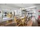Spacious dining room with hardwood floors and connection to kitchen and living areas at 7780 Paw Paw Dr, Nineveh, IN 46164