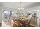 Dining room with hardwood floors, natural light, and access to outdoor dining at 7780 Paw Paw Dr, Nineveh, IN 46164