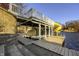 Lakeside dock with boat lift, slide, and steps to water, enhancing waterfront living at 7780 Paw Paw Dr, Nineveh, IN 46164