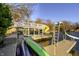 Waterfront dock with boat lift, slide, and kayaks, ideal for lakeside fun and recreation at 7780 Paw Paw Dr, Nineveh, IN 46164