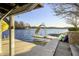 Lakeside dock with slide and kayaks, offering direct access to water fun and scenic views at 7780 Paw Paw Dr, Nineveh, IN 46164