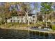 Expansive lakeside property with a private dock and waterfront access, offering stunning views and serene ambiance at 7780 Paw Paw Dr, Nineveh, IN 46164