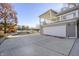 Lakeside home with covered upper porch, lower garage, dock and an expansive concrete driveway at 7780 Paw Paw Dr, Nineveh, IN 46164