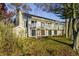 Charming two-story home with a large balcony overlooking the landscaped yard and waterfront at 7780 Paw Paw Dr, Nineveh, IN 46164