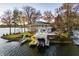 Beautiful lake house with a private dock and boat lift, featuring a spacious deck for outdoor entertainment at 7780 Paw Paw Dr, Nineveh, IN 46164