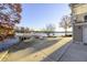 Lakeside home with covered upper porch, lower garage, dock and an expansive concrete driveway at 7780 Paw Paw Dr, Nineveh, IN 46164