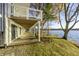 Exterior view of home featuring a lakeside patio and yard at 7780 Paw Paw Dr, Nineveh, IN 46164