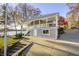 Lakeside home with covered upper porch, lower garage and an expansive concrete driveway at 7780 Paw Paw Dr, Nineveh, IN 46164