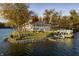 Breathtaking lakefront home with a private dock, boat lift, and outdoor entertaining area on a sprawling landscaped lot at 7780 Paw Paw Dr, Nineveh, IN 46164