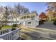 Inviting home exterior with a two-car garage and covered porch near the lake at 7780 Paw Paw Dr, Nineveh, IN 46164