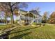 Charming lake house with a large yard, covered decks, and beautiful landscaping at 7780 Paw Paw Dr, Nineveh, IN 46164