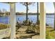 Charming outdoor fire pit area offers a relaxing space to gather by the lake at 7780 Paw Paw Dr, Nineveh, IN 46164
