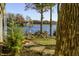 Lakeside yard with fire pit and seating offers an inviting outdoor space at 7780 Paw Paw Dr, Nineveh, IN 46164