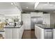 Large kitchen showcases stainless steel appliances, dark countertops, and abundant white cabinetry at 7780 Paw Paw Dr, Nineveh, IN 46164
