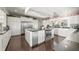 Gourmet kitchen featuring stainless appliances, large island, and abundant white cabinetry for storage at 7780 Paw Paw Dr, Nineveh, IN 46164