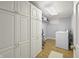 Well-organized laundry room with washer, dryer, and ample storage cabinets at 7780 Paw Paw Dr, Nineveh, IN 46164