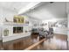 Spacious living room with a brick fireplace and hardwood floors at 7780 Paw Paw Dr, Nineveh, IN 46164
