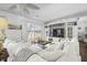 Bright living room boasts a lake view, built-in shelves, and comfortable seating at 7780 Paw Paw Dr, Nineveh, IN 46164
