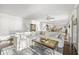 Expansive living room with a cozy sectional sofa, ceiling fan, and bright, white walls at 7780 Paw Paw Dr, Nineveh, IN 46164