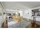 Spacious living space with hardwood floors and seamless flow between living and dining areas at 7780 Paw Paw Dr, Nineveh, IN 46164