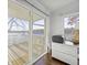 Light-filled office with sliding glass doors to deck and lake views at 7780 Paw Paw Dr, Nineveh, IN 46164