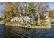 A beautiful waterfront home featuring a private dock and ample outdoor entertaining space at 7780 Paw Paw Dr, Nineveh, IN 46164