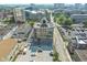 An aerial view of the building, highlighting the architecture, surrounding neighborhood, and parking at 802 N Meridian St # 204, Indianapolis, IN 46204