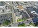 Aerial view of property and neighborhood showcasing the building and a nearby church on a sunny day at 802 N Meridian St # 204, Indianapolis, IN 46204