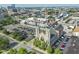 Aerial view showcasing the building, its proximity to parking, and surrounding cityscape at 802 N Meridian St # 204, Indianapolis, IN 46204