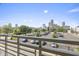 Balcony boasting scenic views of the city skyline and green trees at 802 N Meridian St # 204, Indianapolis, IN 46204