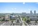 A distant aerial view showcasing the building, the architecture and its surrounding neighborhood on a sunny day at 802 N Meridian St # 204, Indianapolis, IN 46204