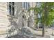 Beautiful stone building exterior featuring grand arched entryways and decorative pillars at 802 N Meridian St # 204, Indianapolis, IN 46204