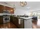 A modern kitchen features stainless steel appliances, granite countertops, and stylish pendant lighting at 802 N Meridian St # 204, Indianapolis, IN 46204