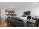 Spacious living area with hardwood floors and a contemporary design, seamlessly flowing into the kitchen at 802 N Meridian St # 204, Indianapolis, IN 46204