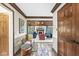 Inviting foyer featuring wood trim, tile floor, and view into living room with fireplace at 8425 N Halyard N Way, Indianapolis, IN 46236
