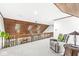 Spacious loft area with wood ceiling, skylights, railing, and view of the lower level living room at 8425 N Halyard N Way, Indianapolis, IN 46236