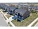 Two-story home showing off its well-manicured lawn, long driveway, and beautiful brown exterior at 8729 Dorill Creek Ln, Indianapolis, IN 46259