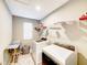 Bright laundry room with modern washer and dryer, plus ample shelving for storage at 8729 Dorill Creek Ln, Indianapolis, IN 46259