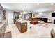 Open-concept living space with modern island, a spacious layout, and elegant finishes at 8729 Dorill Creek Ln, Indianapolis, IN 46259