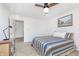Bright bedroom with a striped quilt, neutral carpet, and classic artwork, offering a comfortable retreat at 8820 Yardley Ct # 101, Indianapolis, IN 46268
