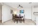 Well-lit dining room with a dark wood table and four upholstered chairs at 8820 Yardley Ct # 101, Indianapolis, IN 46268