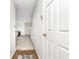 Bright hallway leading into the living area showcases clean walls, a new-looking carpet and a glimpse of the home's layout at 8820 Yardley Ct # 101, Indianapolis, IN 46268