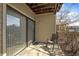 Secluded patio perfect for relaxation with a chair and sliding glass door access to the interior at 8820 Yardley Ct # 101, Indianapolis, IN 46268