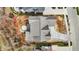 Birds eye view of a meticulously designed home showcasing the roofline, landscaping, and backyard hardscaping at 908 Oak Terrace Rd, Westfield, IN 46074