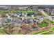 Panoramic view of a neighborhood nestled near a golf course, showcasing a mix of architectural styles and mature trees at 908 Oak Terrace Rd, Westfield, IN 46074