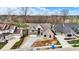 Aerial view of a luxurious home with a long driveway and landscaping, situated on a large lot at 908 Oak Terrace Rd, Westfield, IN 46074