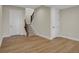 Spacious basement area with wood flooring, neutral walls, and a staircase to the main floor at 908 Oak Terrace Rd, Westfield, IN 46074